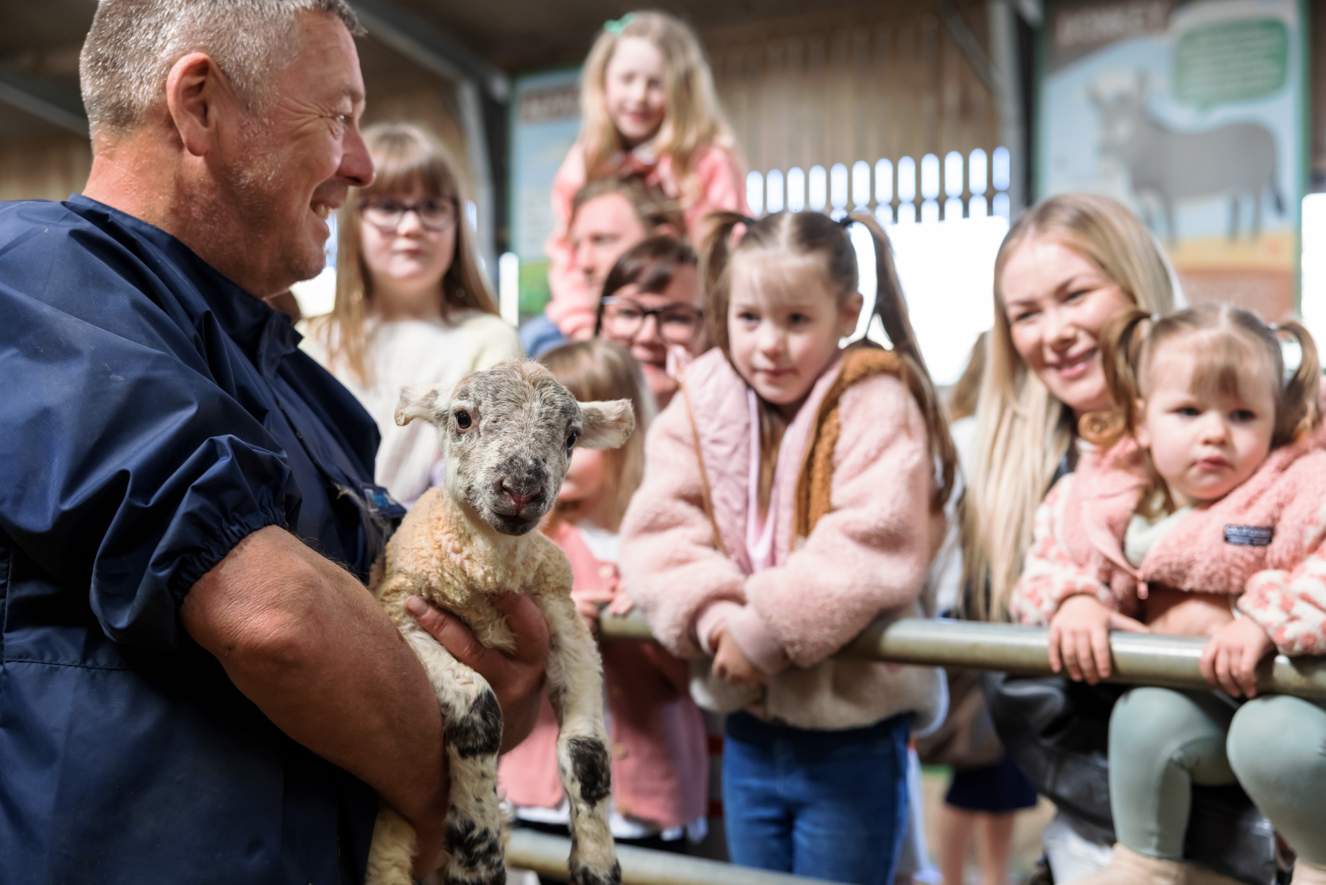 Children being taught about lambs