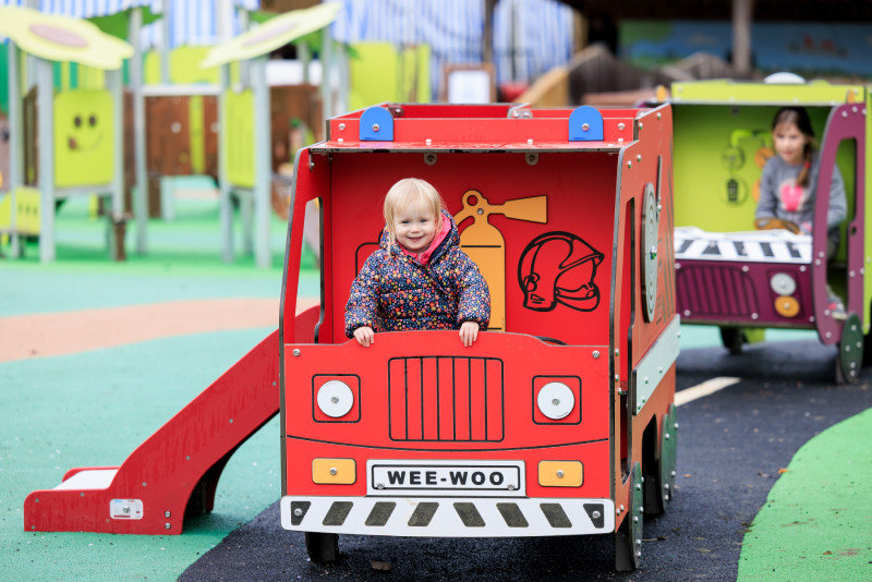 Child playing in the firetruck
