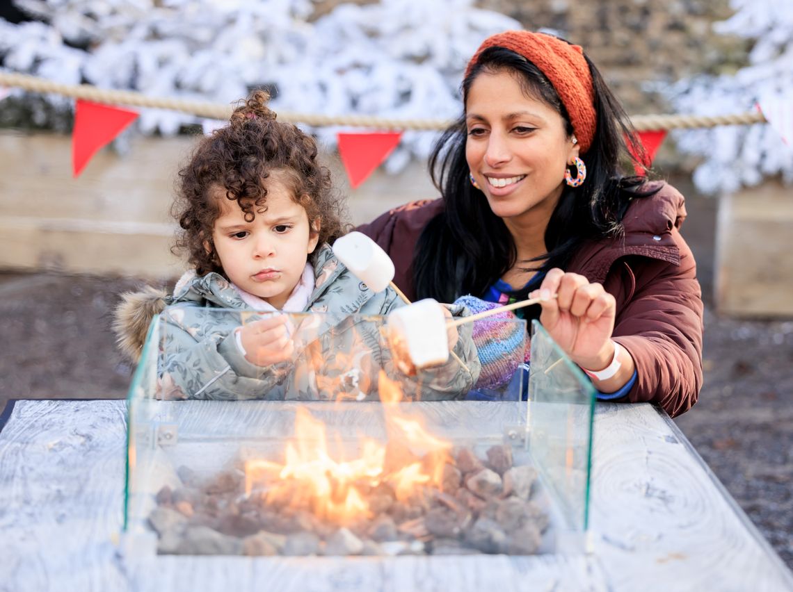 Toast marshmallows around the fire